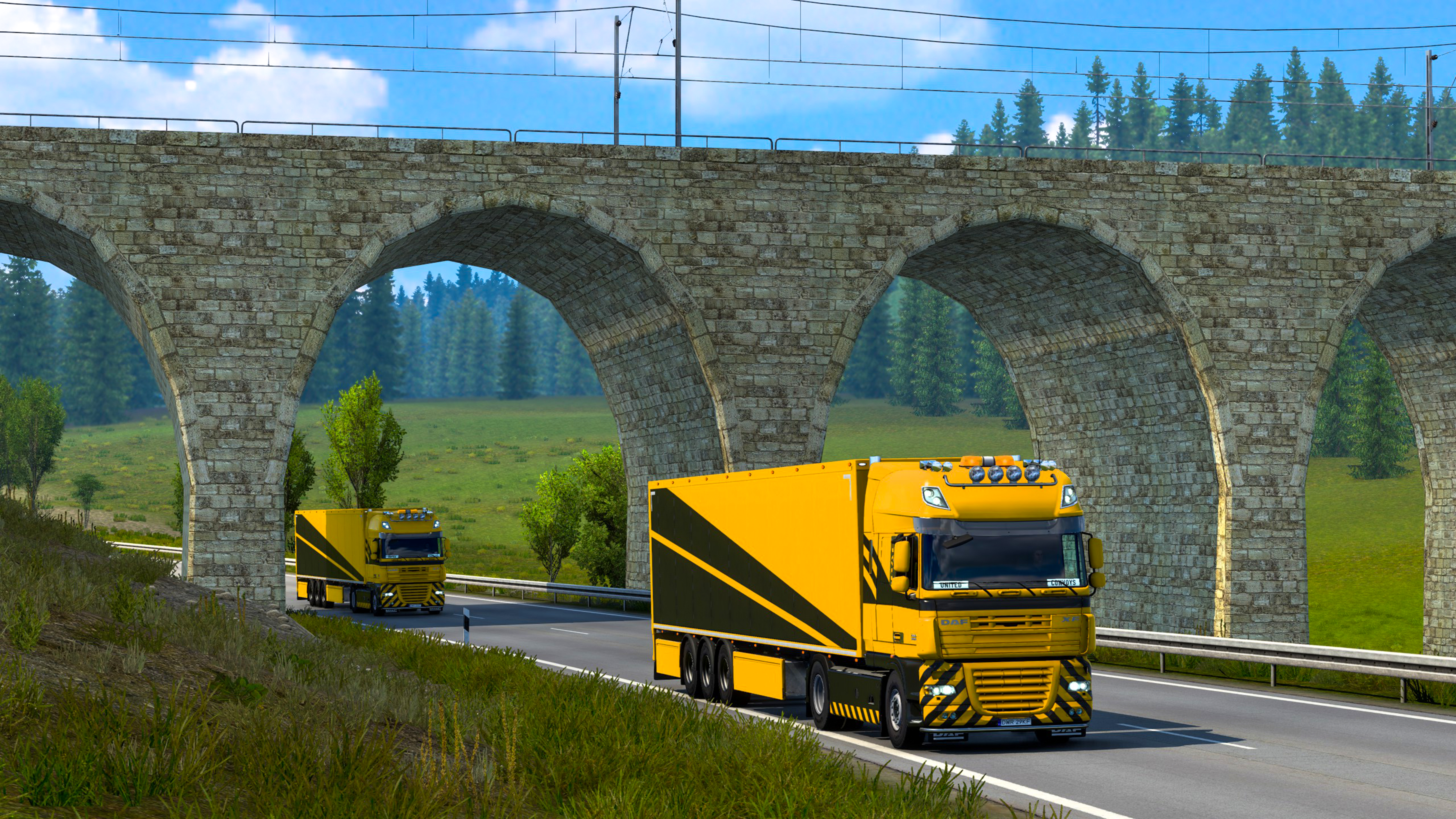 An image of two UC trucks